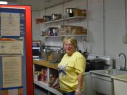 woman smiling in a kitchen