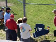 people watching softball game