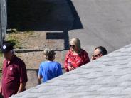 people watching softball game