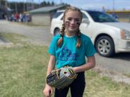 girl in baseball uniform