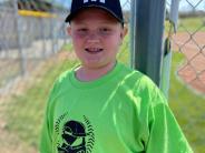 boy in baseball uniform