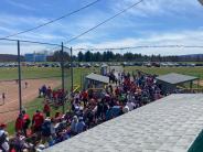 large group of people at softball game